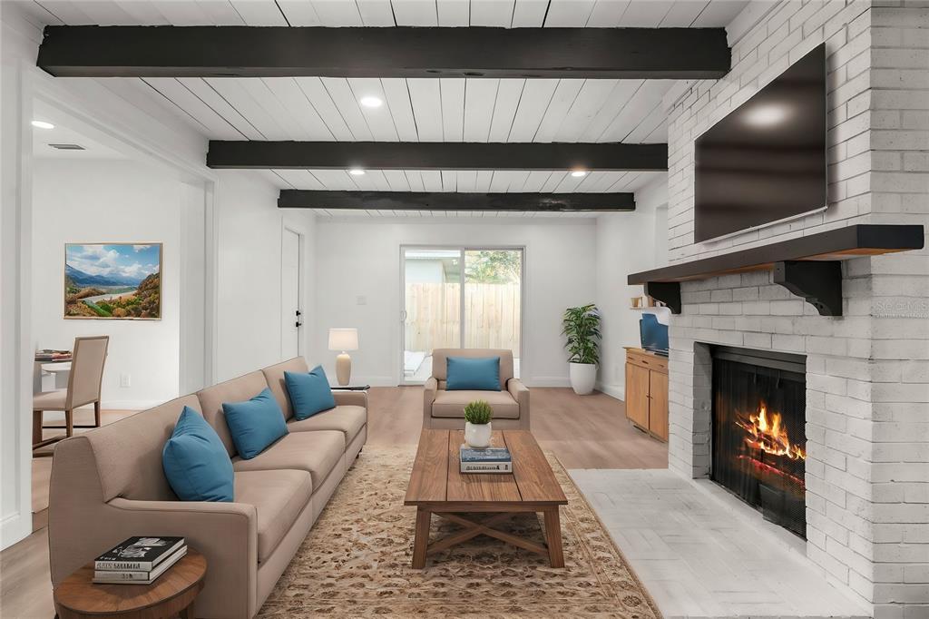 2203 Nottingham Road South Daytona, FL 32119 - Photo 4 of 40 a living room with furniture and a fireplace