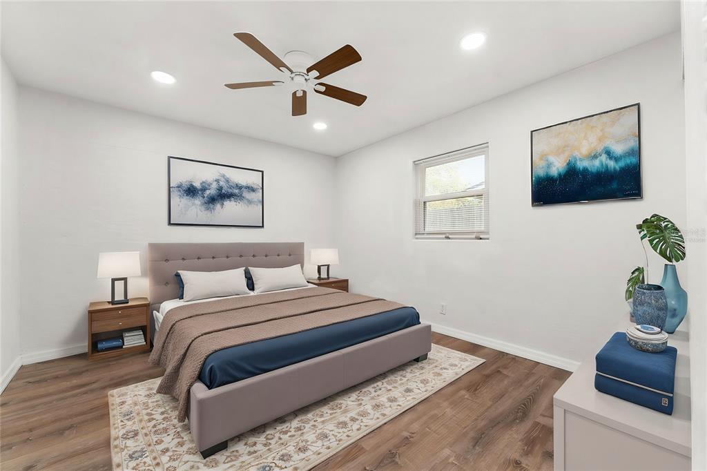 2203 Nottingham Road South Daytona, FL 32119 - Photo 5 of 40 a bedroom with a large bed and a couch