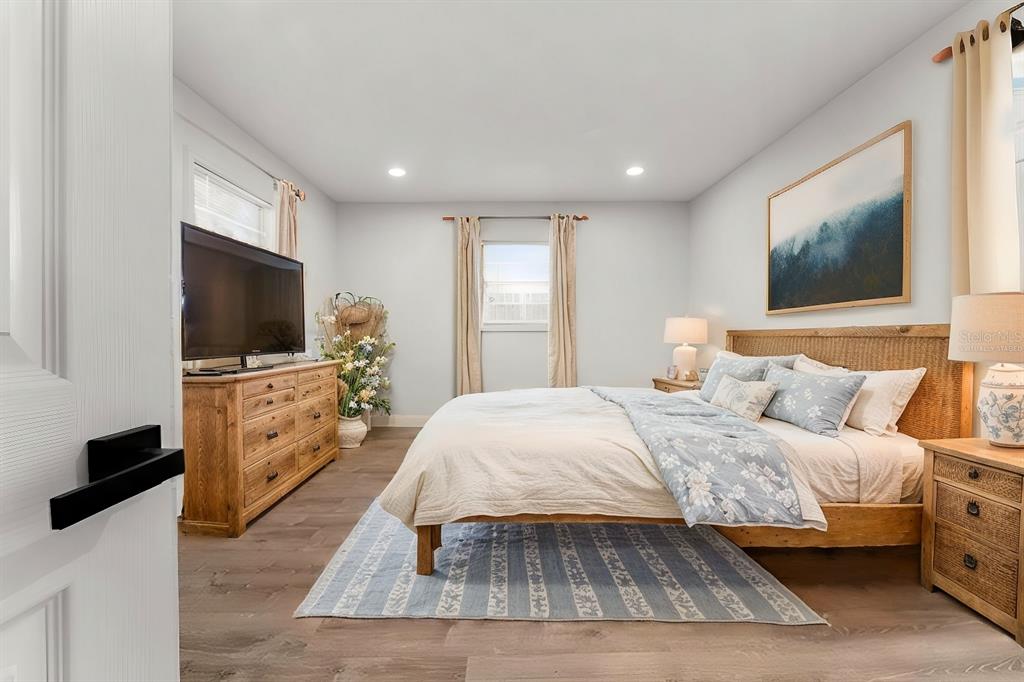 2203 Nottingham Road South Daytona, FL 32119 - Photo 6 of 40 a bedroom with a bed and a flat screen tv