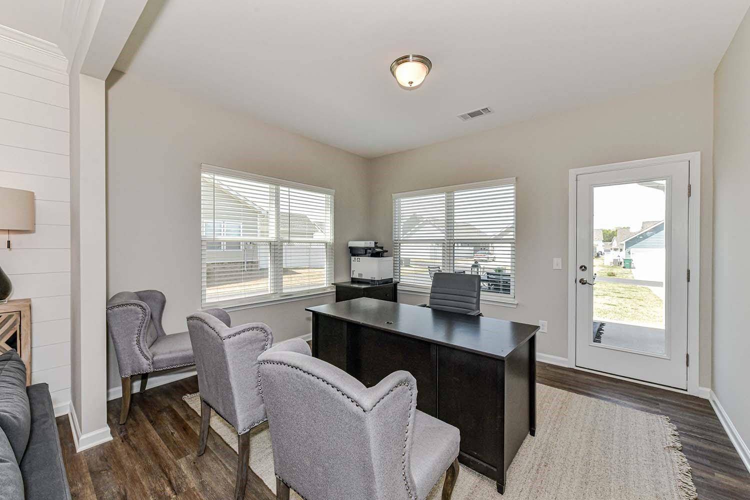 277 Harrison Lane Locust, NC 28097 - Photo 11 of 25 a view of a dining room with furniture and windows