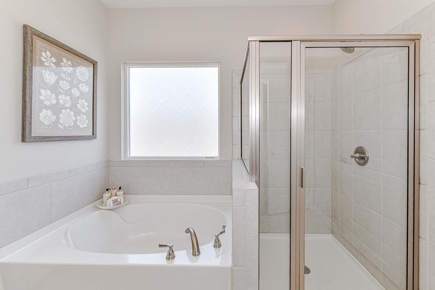 277 Harrison Lane Locust, NC 28097 - Photo 16 of 25 a white bath tub sitting next to a shower