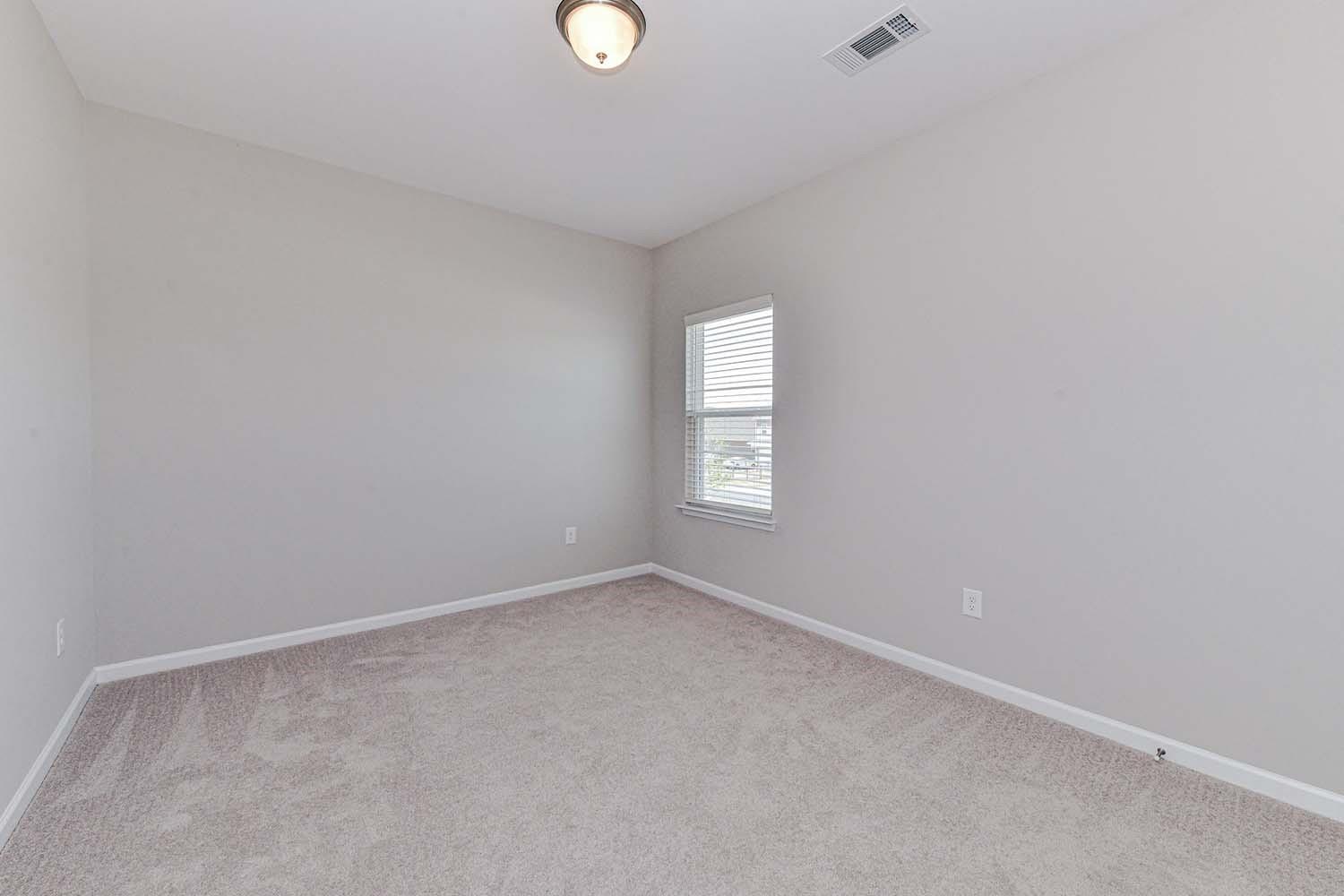 277 Harrison Lane Locust, NC 28097 - Photo 19 of 25 an empty room with windows