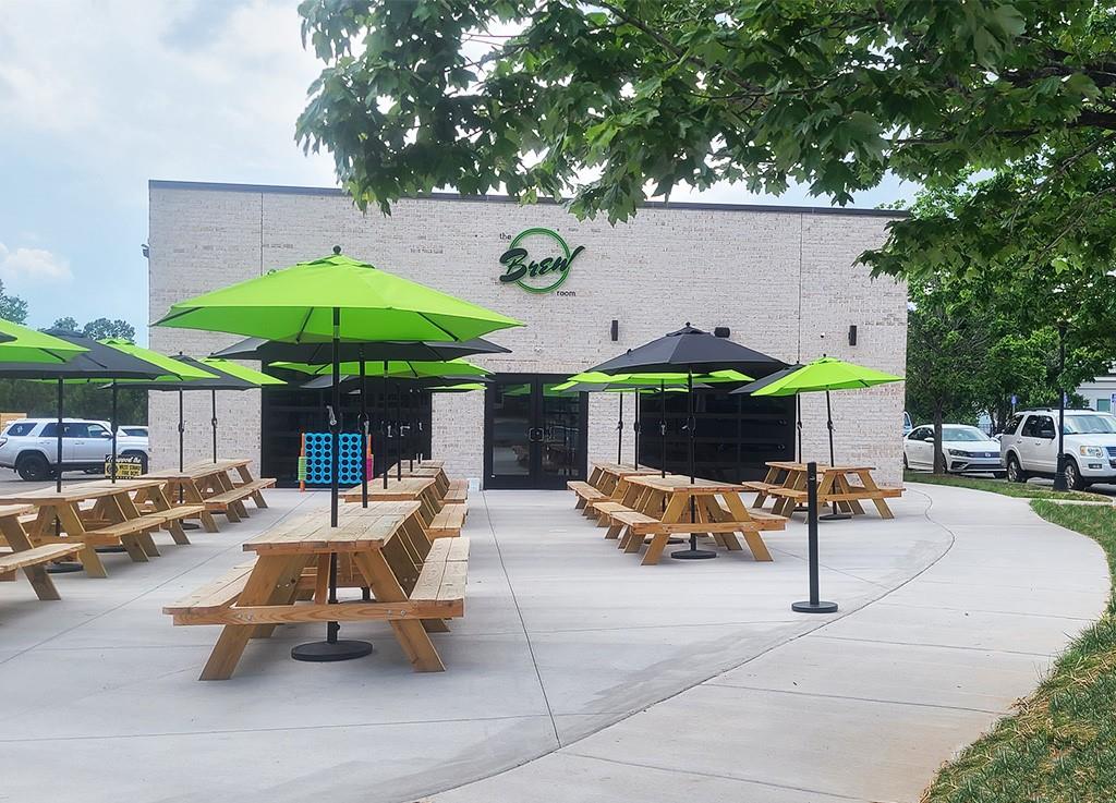 277 Harrison Lane Locust, NC 28097 - Photo 21 of 25 a view of a patio with a table and chairs under an umbrella