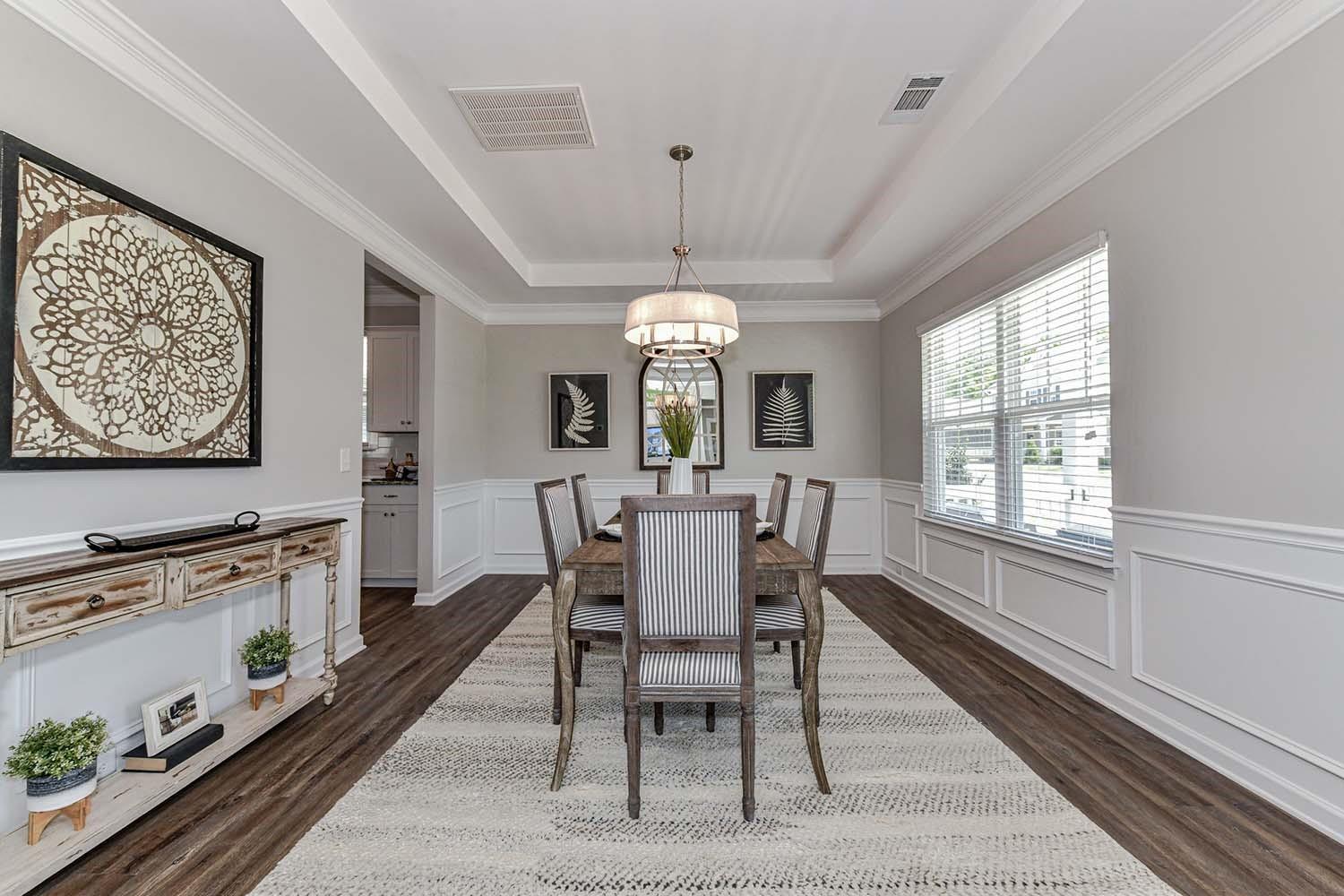 277 Harrison Lane Locust, NC 28097 - Photo 3 of 25 a view of a dining room with furniture window and wooden floor
