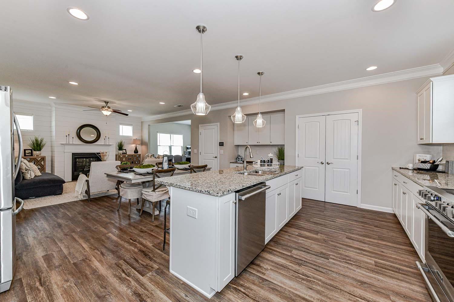 277 Harrison Lane Locust, NC 28097 - Photo 5 of 25 a large kitchen with stainless steel appliances lots of counter space and a sink