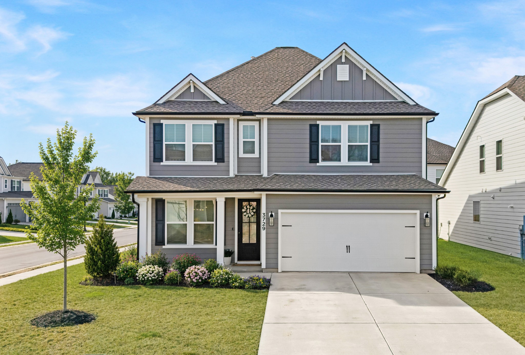 a front view of a house with a yard