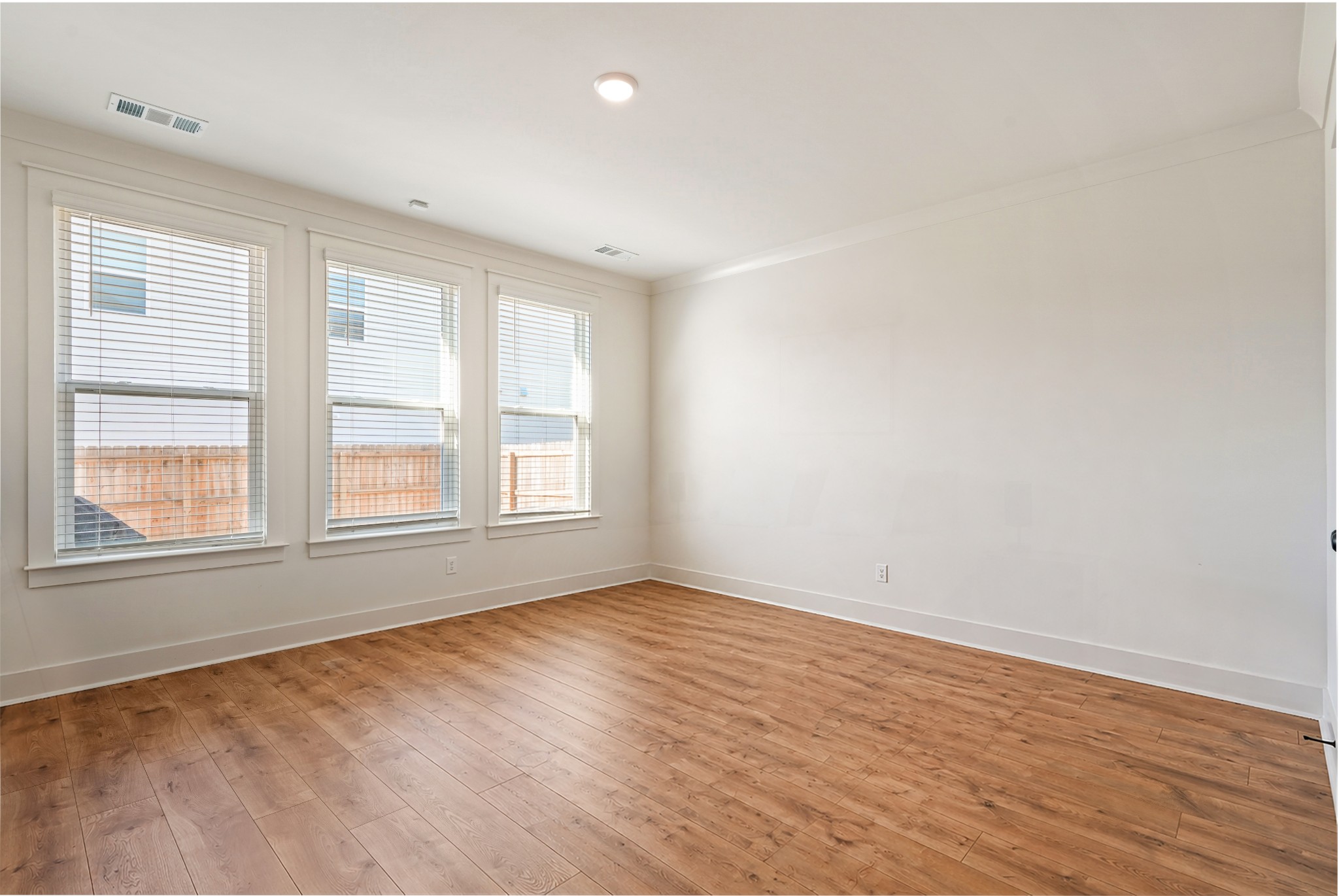 3729 Felipe Way Murfreesboro, TN 37129 - Photo 11 of 32 an empty room with wooden floor and windows