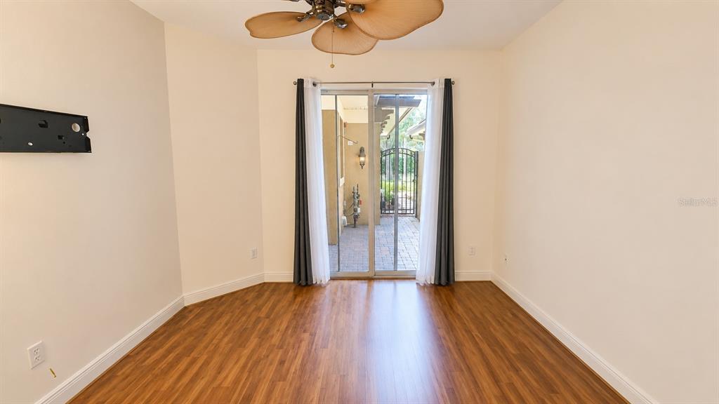 6552 Moorings Point Circle, Unit 102 Lakewood Ranch, FL 34202 - Photo 25 of 57 a view of a room with wooden floor fan and a window