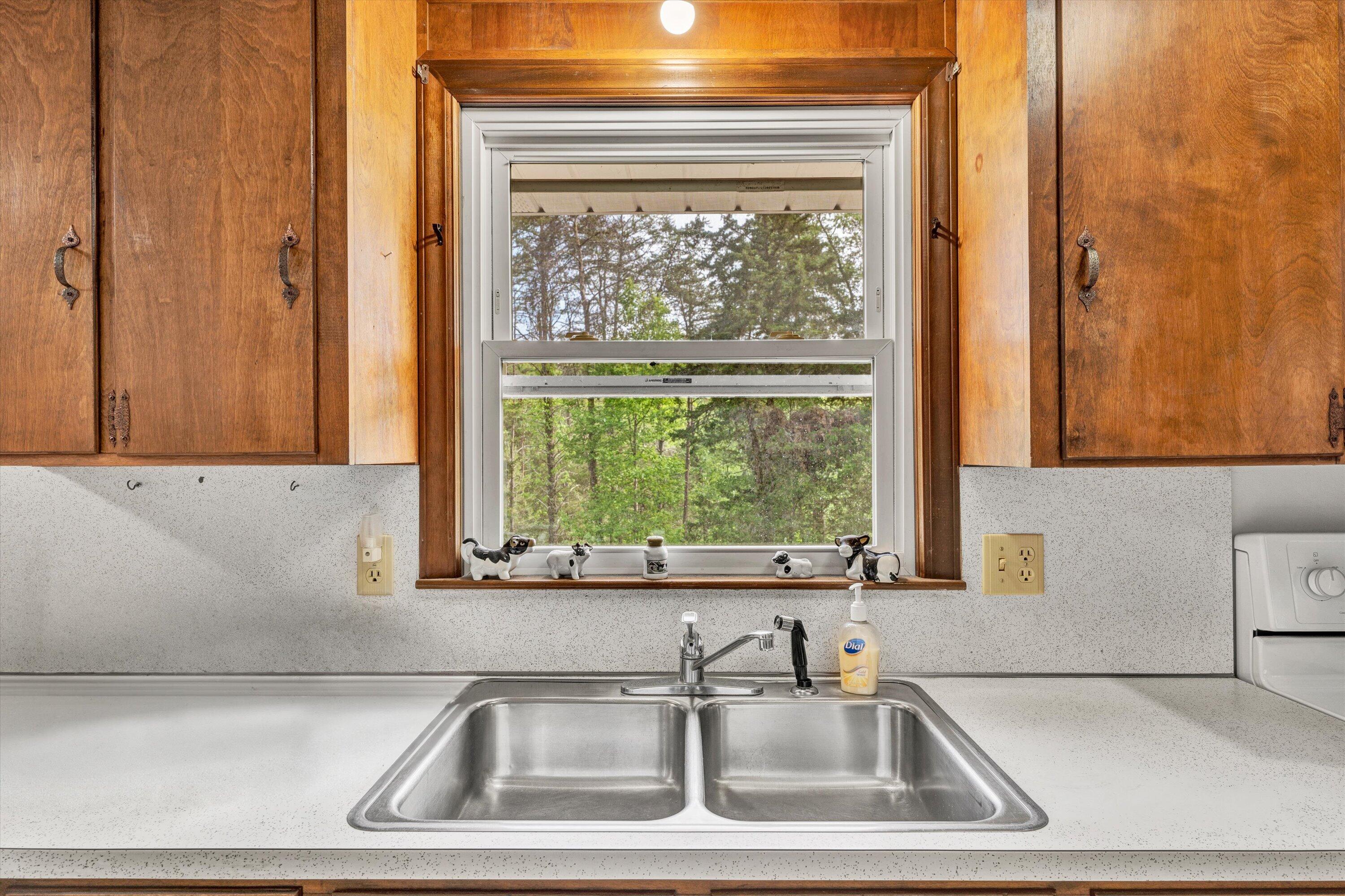 2296 Sandy Level Road Goodview, VA 24095 - Photo 15 of 48 a bathroom with a sink and a window