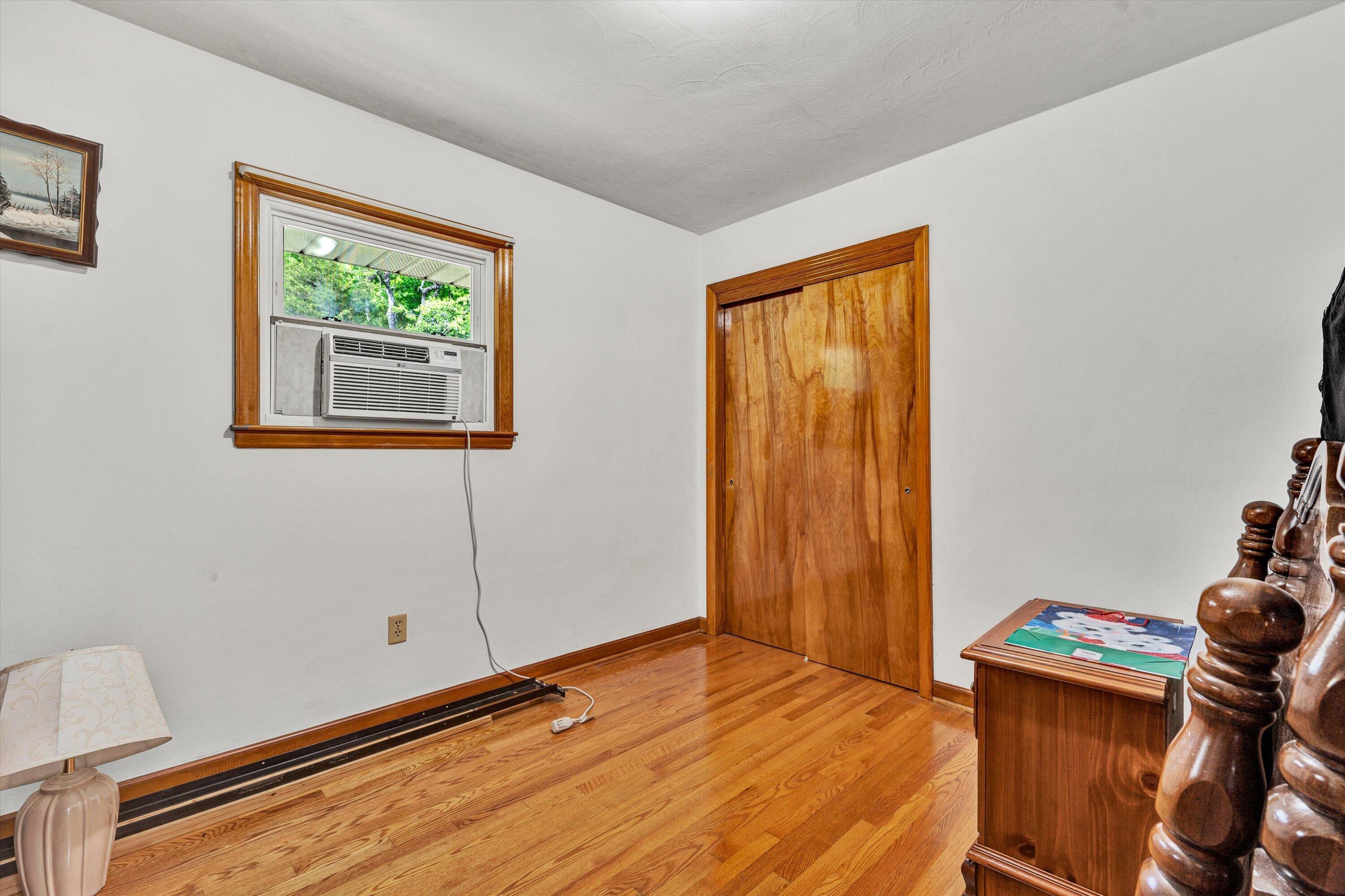 2296 Sandy Level Road Goodview, VA 24095 - Photo 19 of 48 a bedroom with a bed and a window