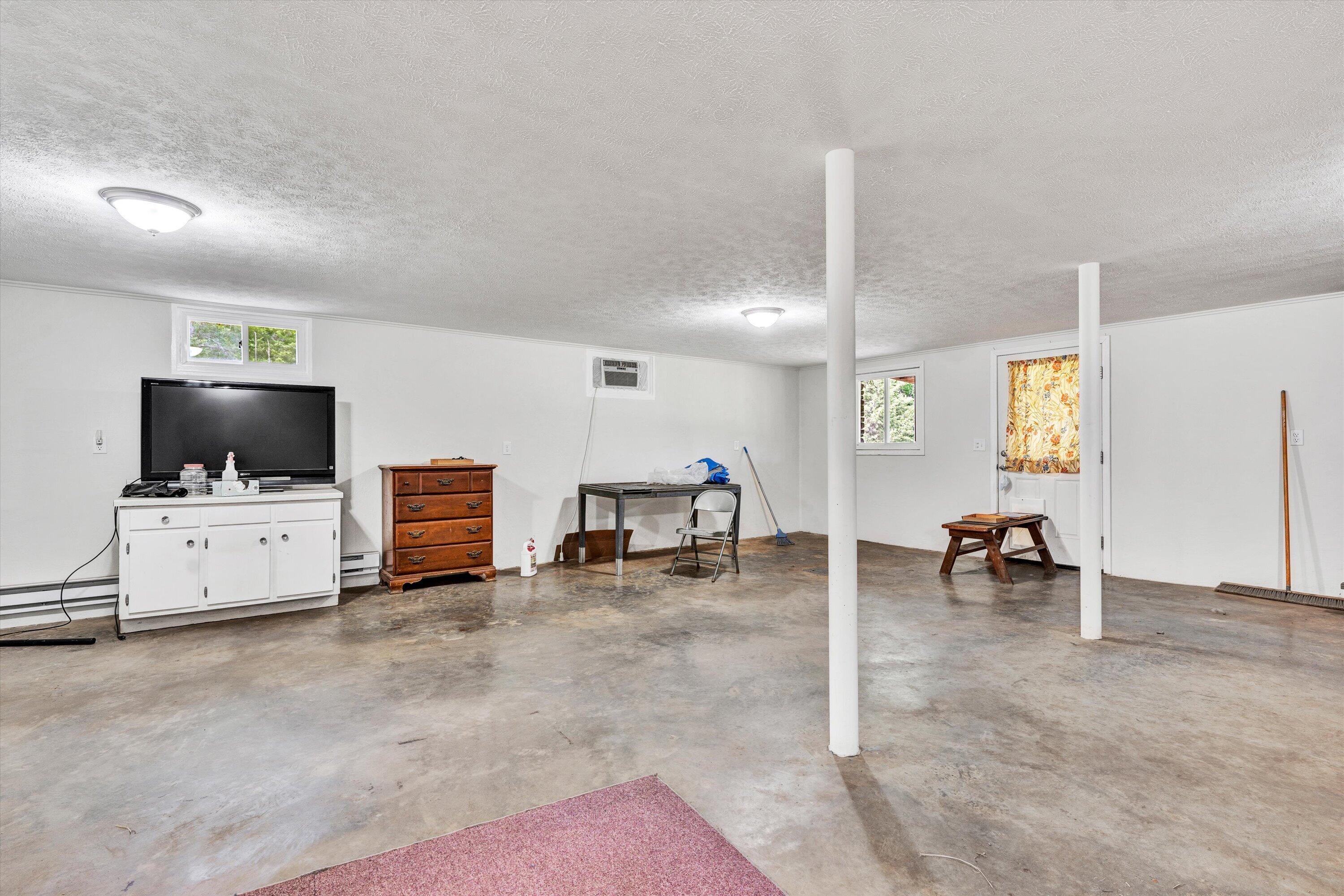 2296 Sandy Level Road Goodview, VA 24095 - Photo 24 of 48 a view of living room with furniture and flat screen tv