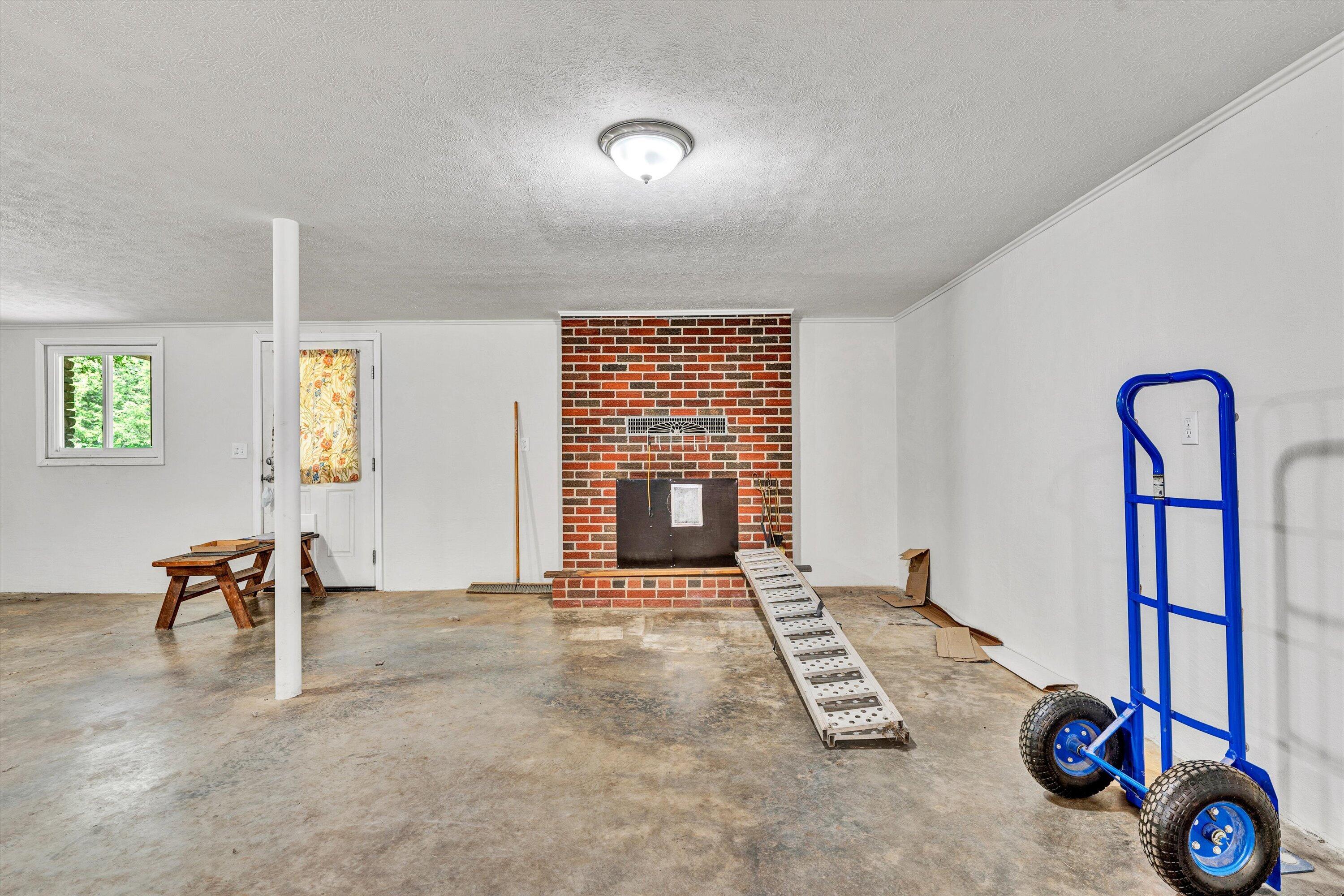 2296 Sandy Level Road Goodview, VA 24095 - Photo 26 of 48 a view of an empty room with window and kitchen view