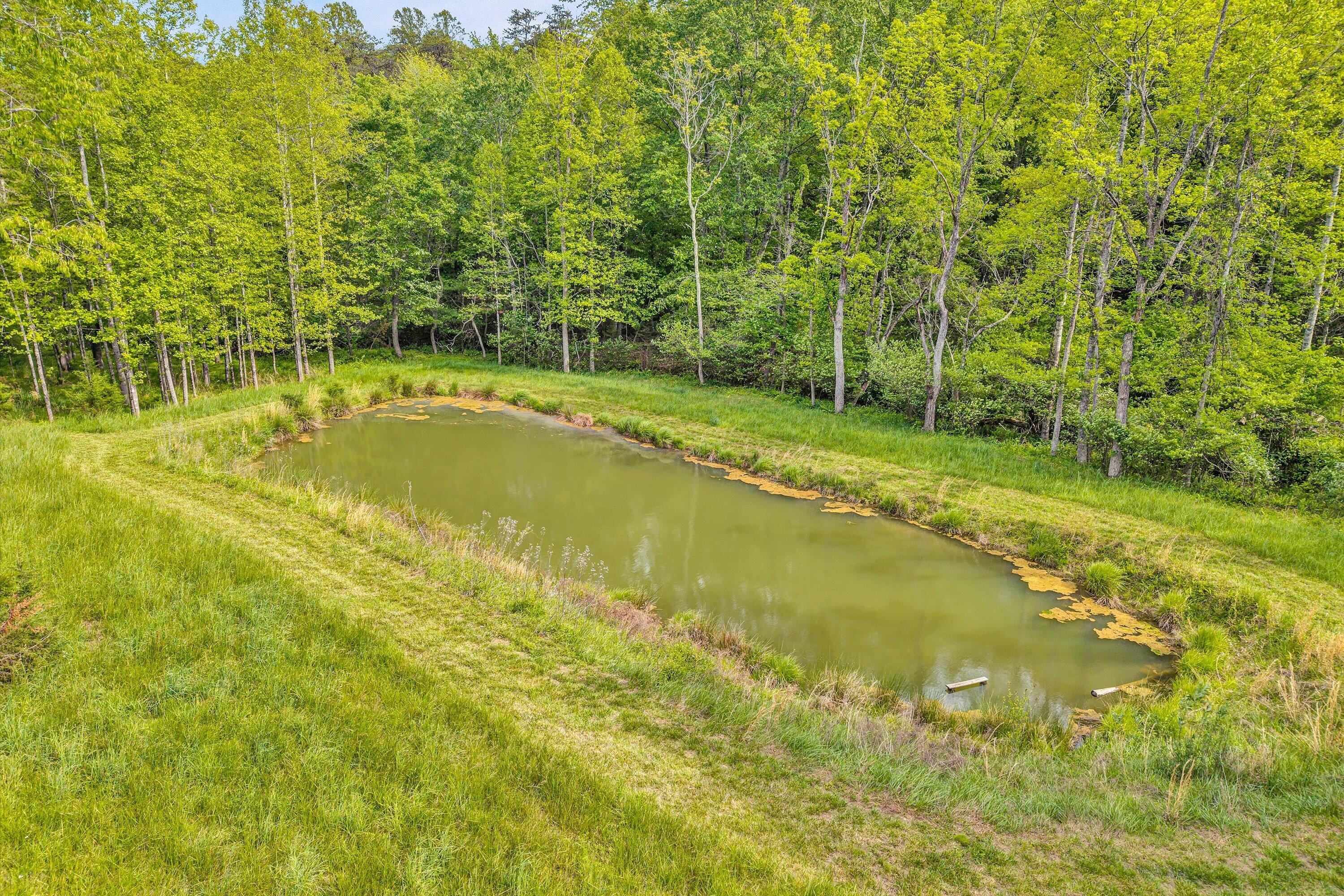 2296 Sandy Level Road Goodview, VA 24095 - Photo 28 of 48 a view of a swimming pool with an outdoor space and seating area