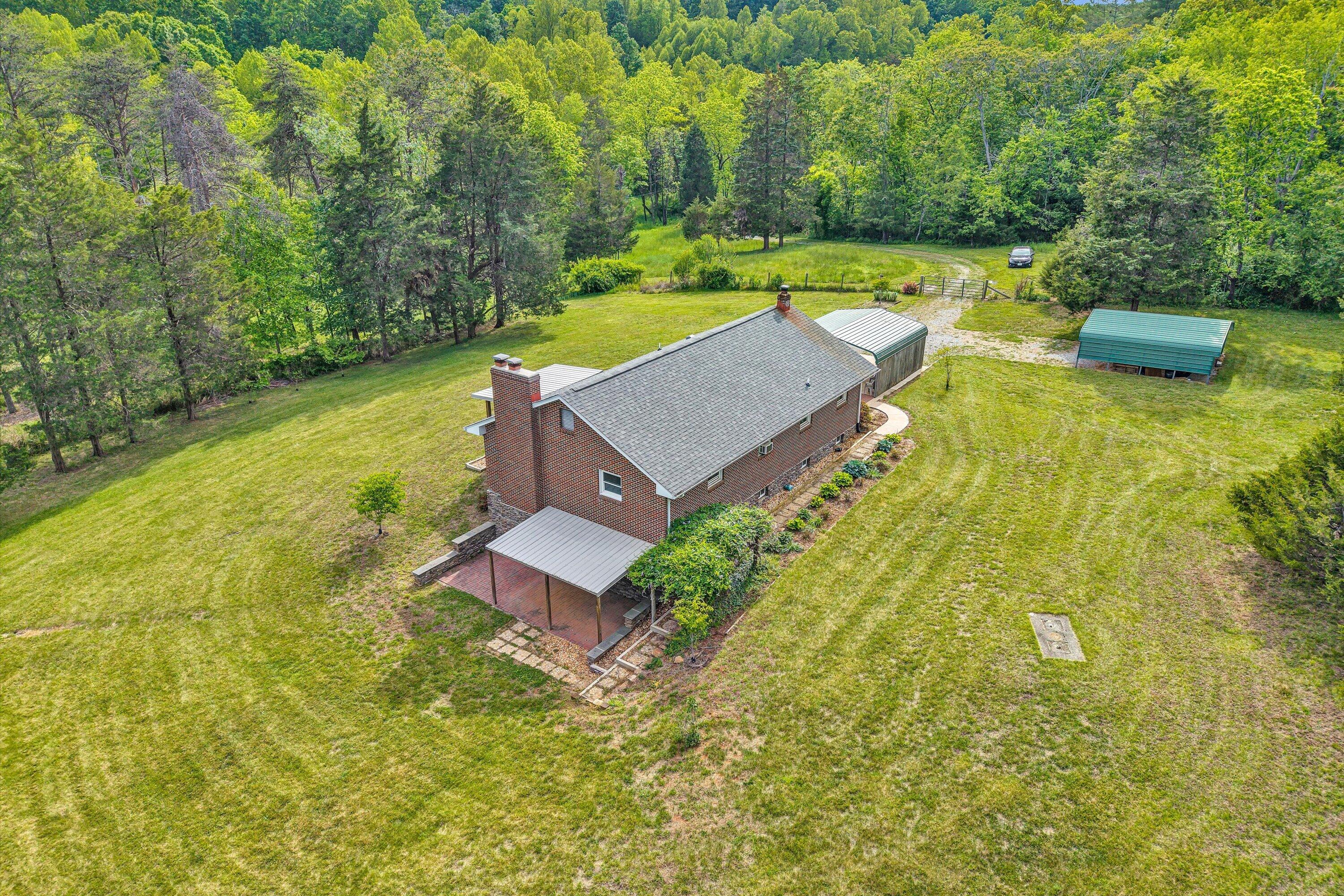 2296 Sandy Level Road Goodview, VA 24095 - Photo 4 of 48 a view of a house with a yard