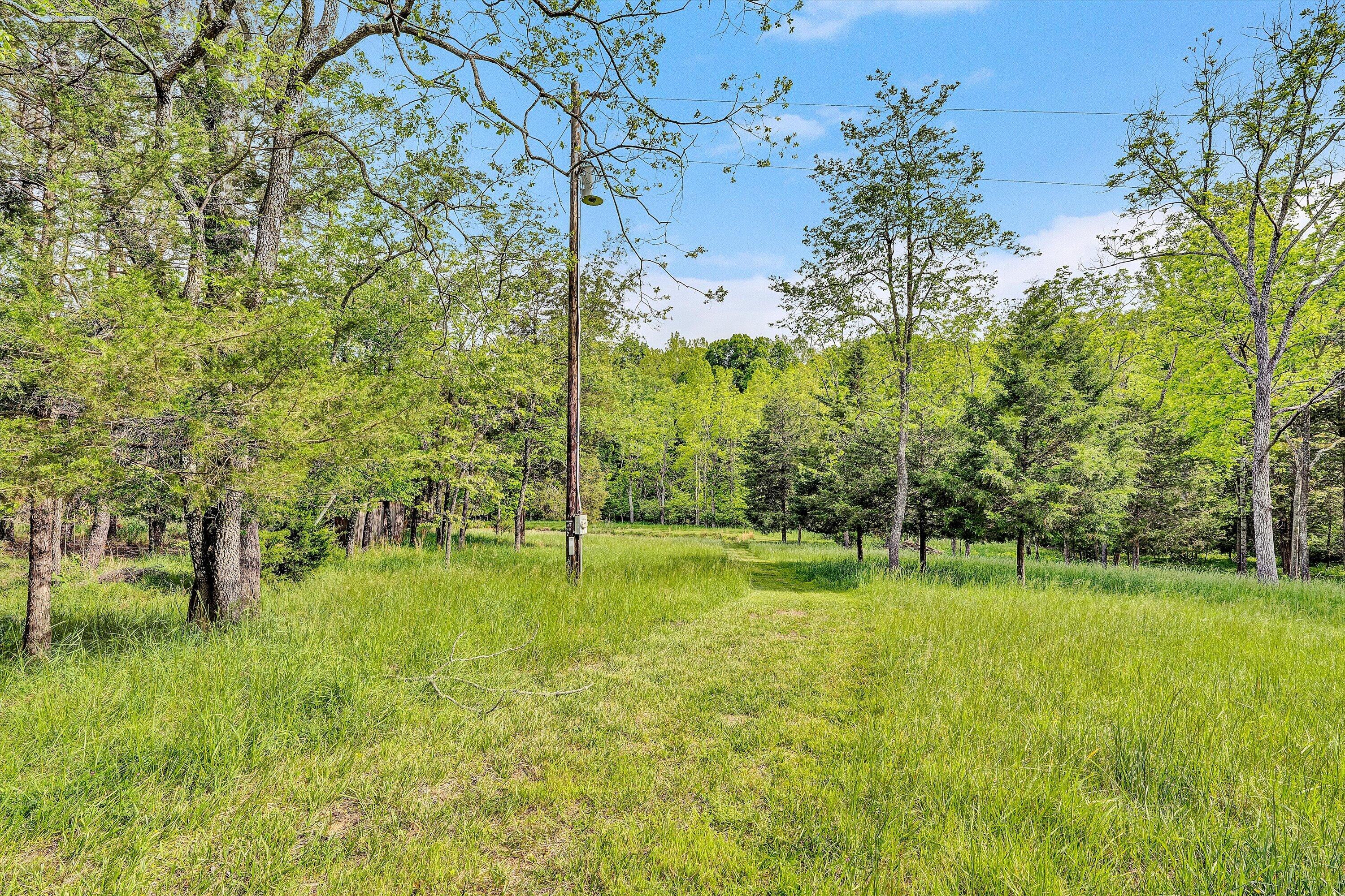 2296 Sandy Level Road Goodview, VA 24095 - Photo 41 of 48 a backyard of a house with a yard and outdoor seating