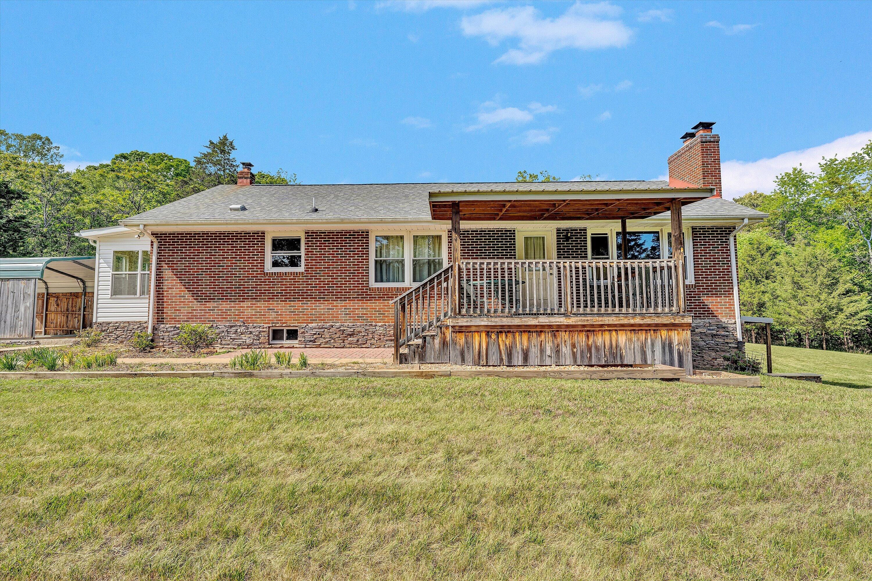 2296 Sandy Level Road Goodview, VA 24095 - Photo 7 of 48 a front view of house with yard