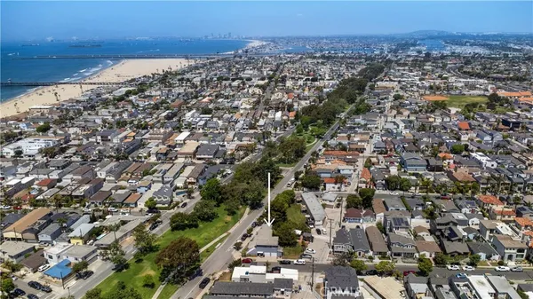an aerial view of houses with outdoor space