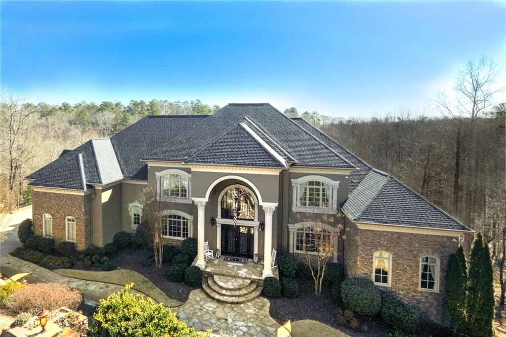 8395 Jett Ferry Road Sandy Springs, GA 30350 - Photo 1 of 1 a front view of a house with a yard