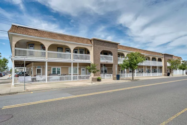 a front view of a building with a street