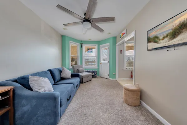a living room with furniture and a window