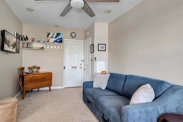 a kitchen with furniture and a window