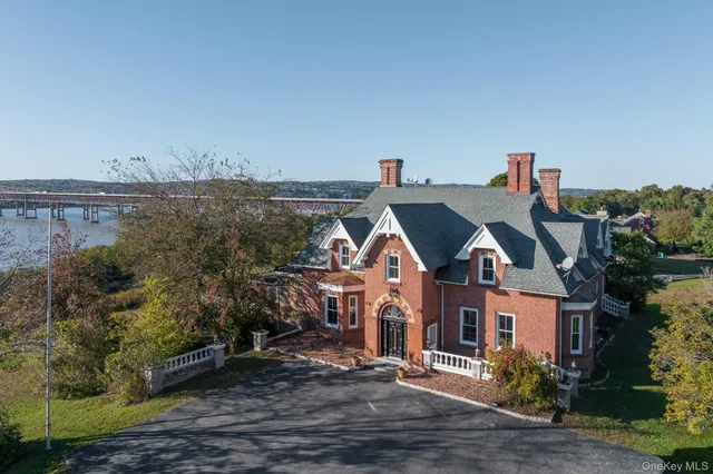 a view of a big house with a street
