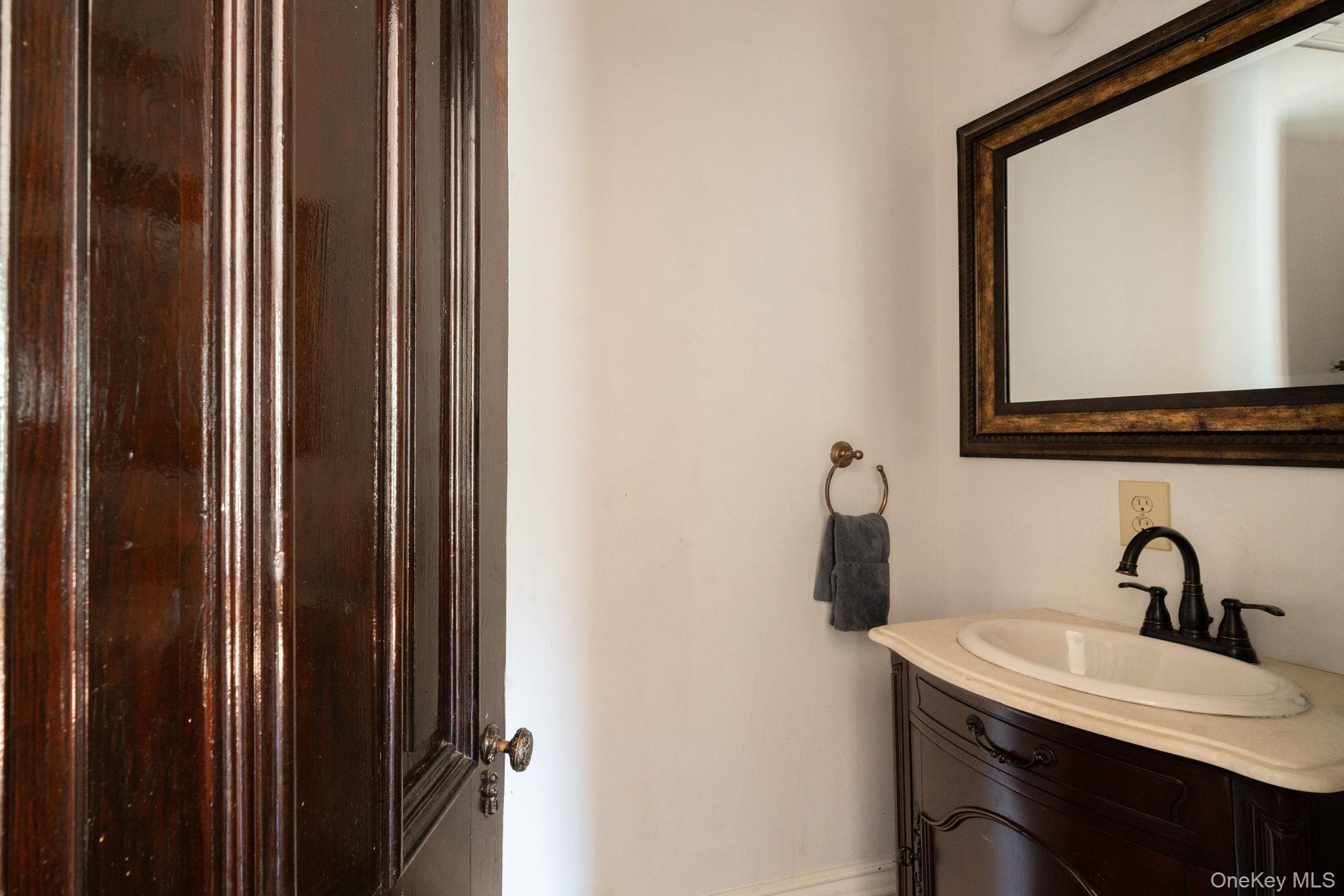 12 Monell Place Beacon, NY 12508 - Photo 15 of 27 a bathroom with a sink and a mirror