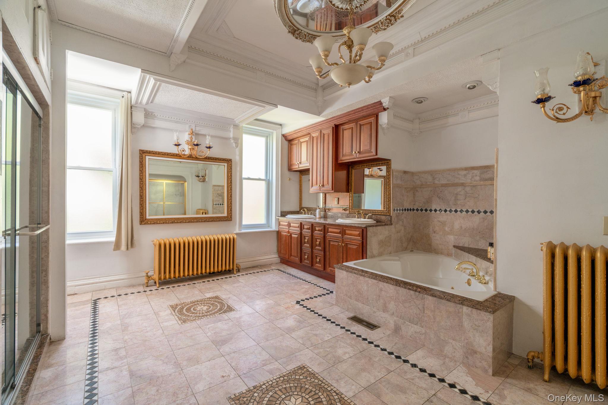 12 Monell Place Beacon, NY 12508 - Photo 16 of 27 a bathroom with a tub sink shower and mirror