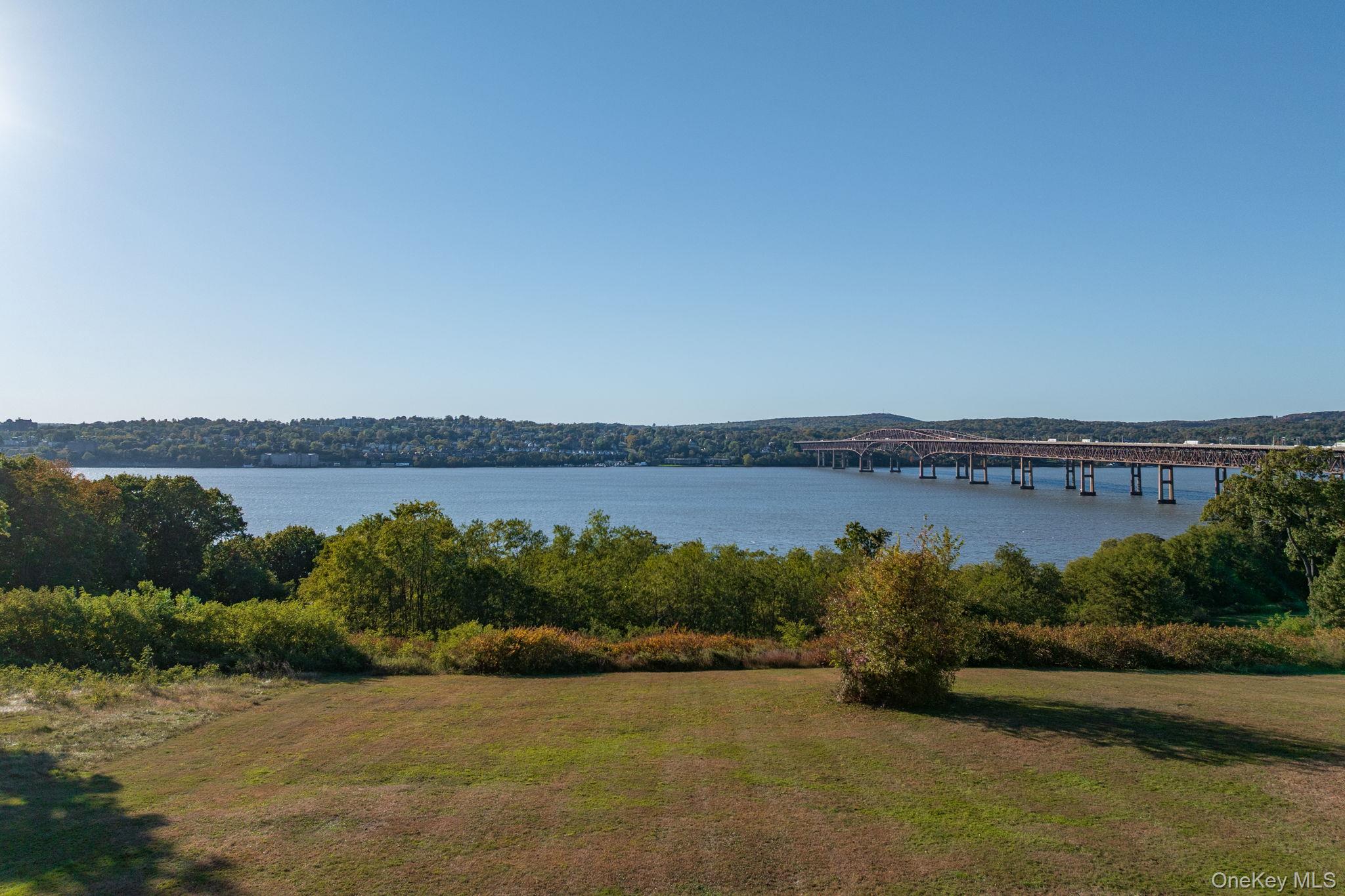 12 Monell Place Beacon, NY 12508 - Photo 26 of 27 a view of a lake with a building in the background