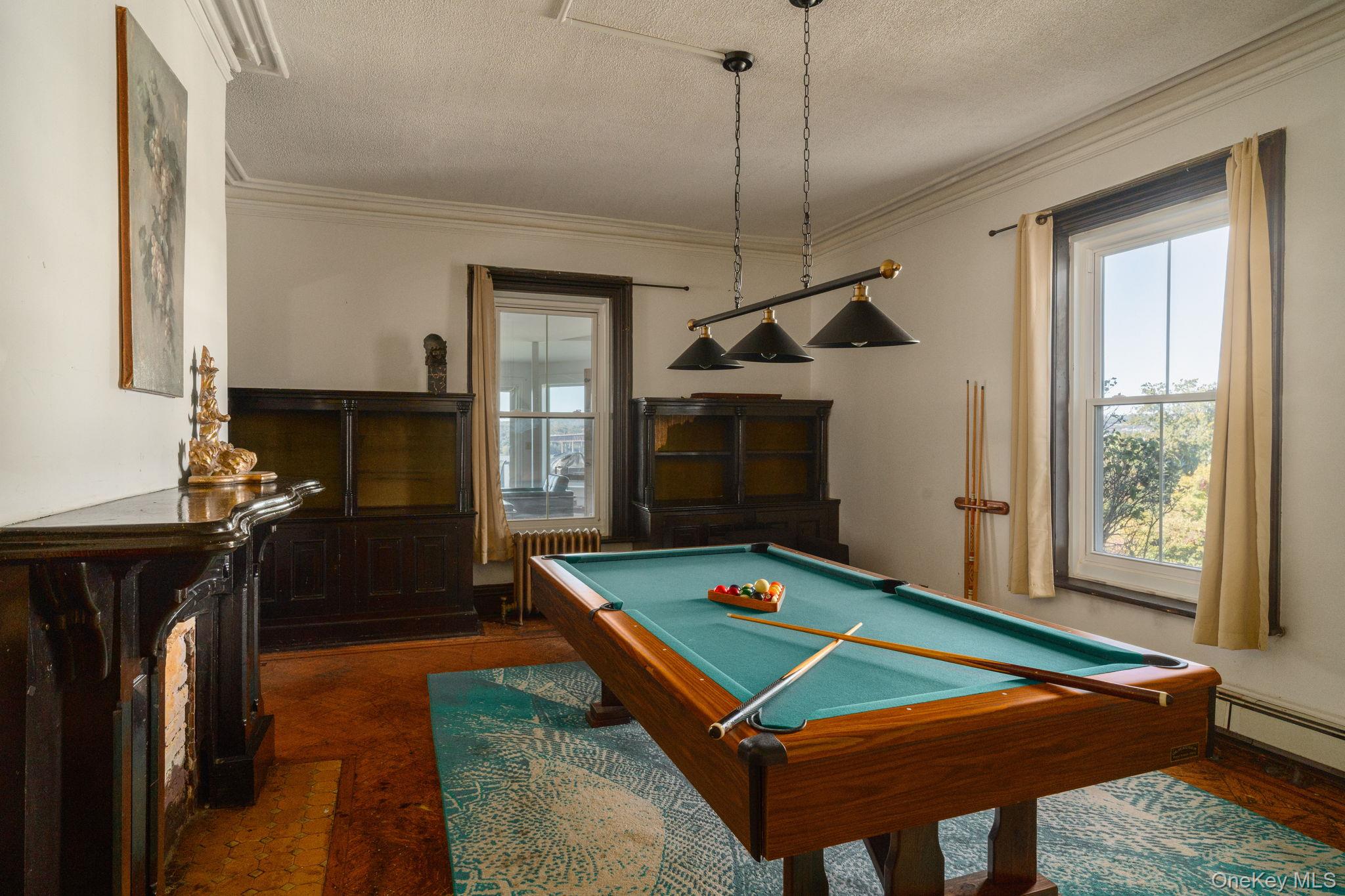 12 Monell Place Beacon, NY 12508 - Photo 8 of 27 a room with pool table flat screen tv and windows