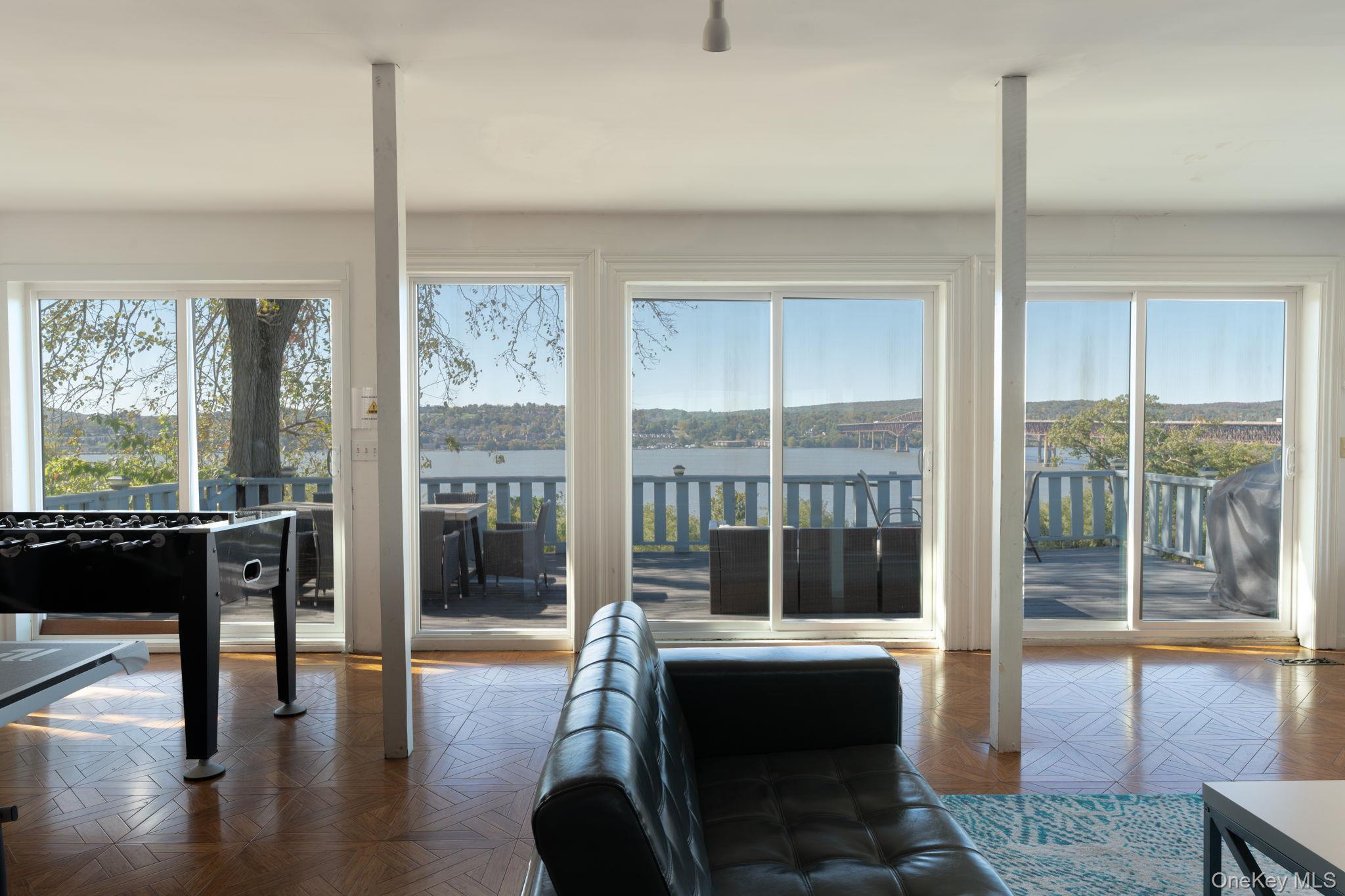 12 Monell Place Beacon, NY 12508 - Photo 10 of 27 a view of hall with living room and floor to ceiling window