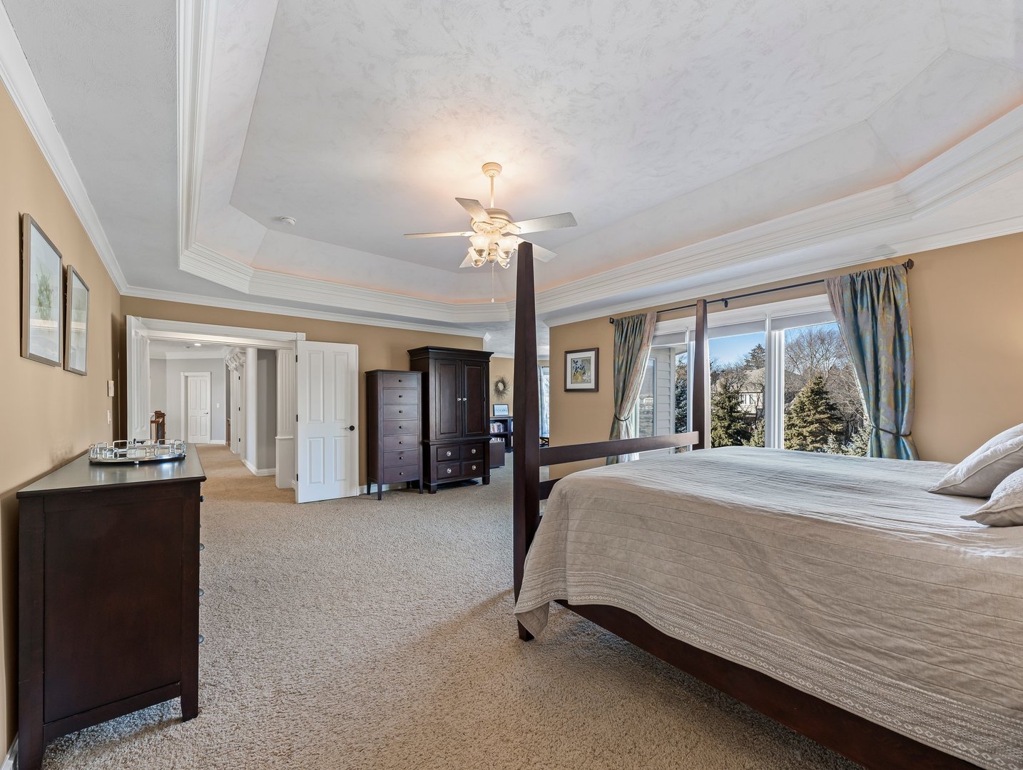 63 Mitchell Circle Wheaton, IL 60189 - Photo 22 of 54 a bedroom with a bed and a chandelier