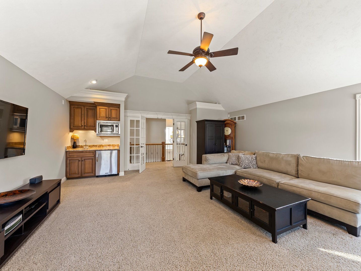 63 Mitchell Circle Wheaton, IL 60189 - Photo 34 of 54 a living room with furniture and a flat screen tv