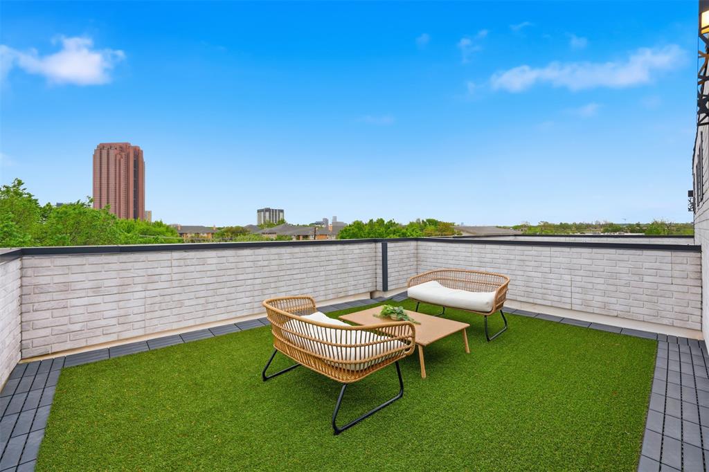 1920 Caddo Street, Unit 204 Dallas, TX 75204 - Photo 2 of 33 a view of a chairs and table on the terrace