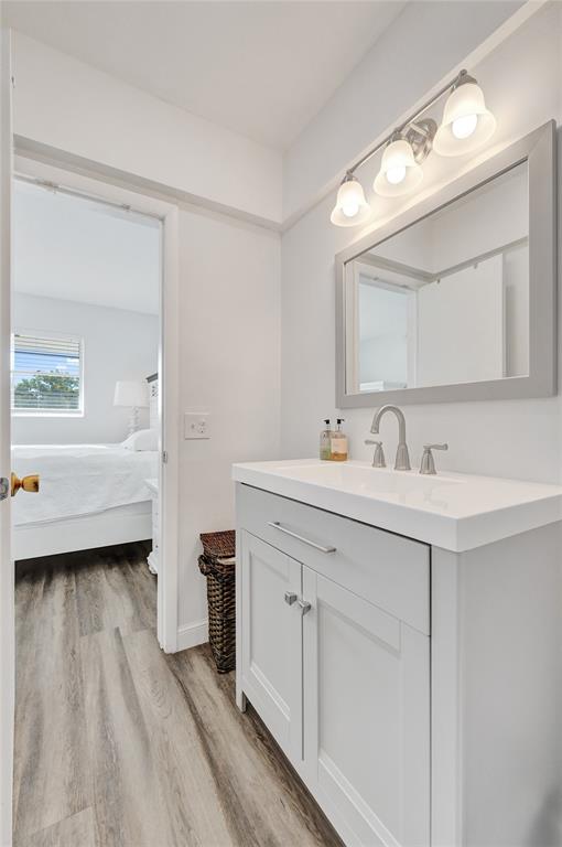 2751 East Golf Boulevard, Unit 2019 Pompano Beach, FL 33064 - Photo 15 of 68 a spacious bathroom with a double vanity sink and a mirror