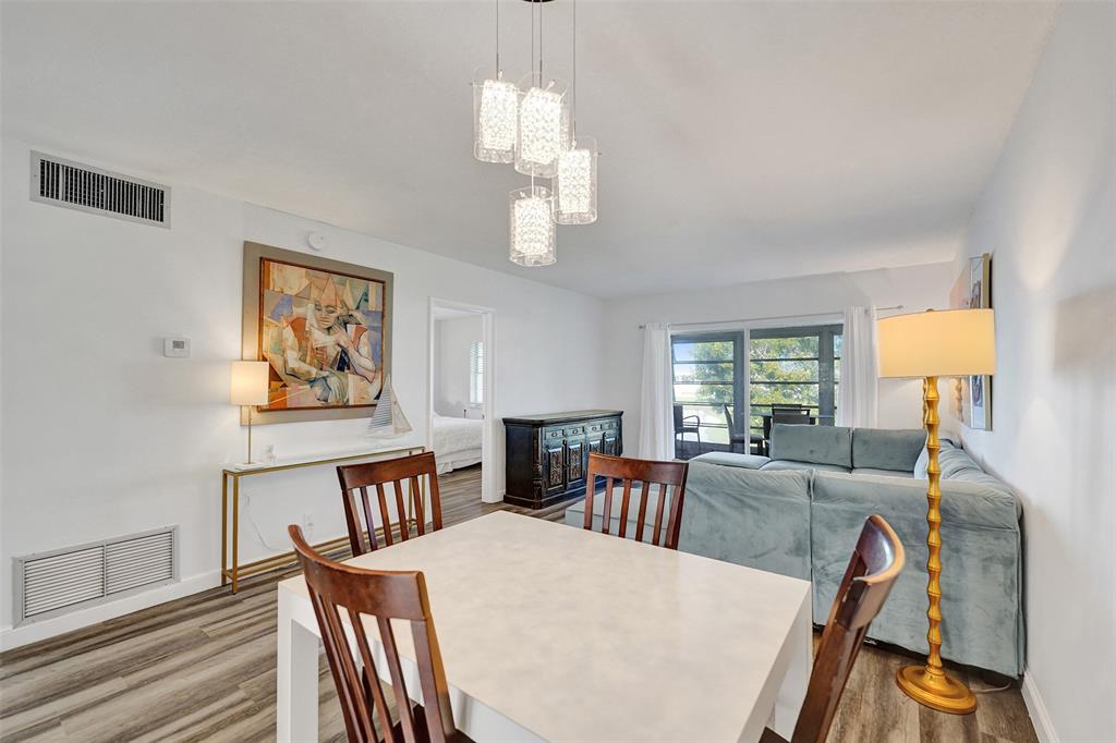 2751 East Golf Boulevard, Unit 2019 Pompano Beach, FL 33064 - Photo 21 of 68 a view of a dining room with furniture window and outside view