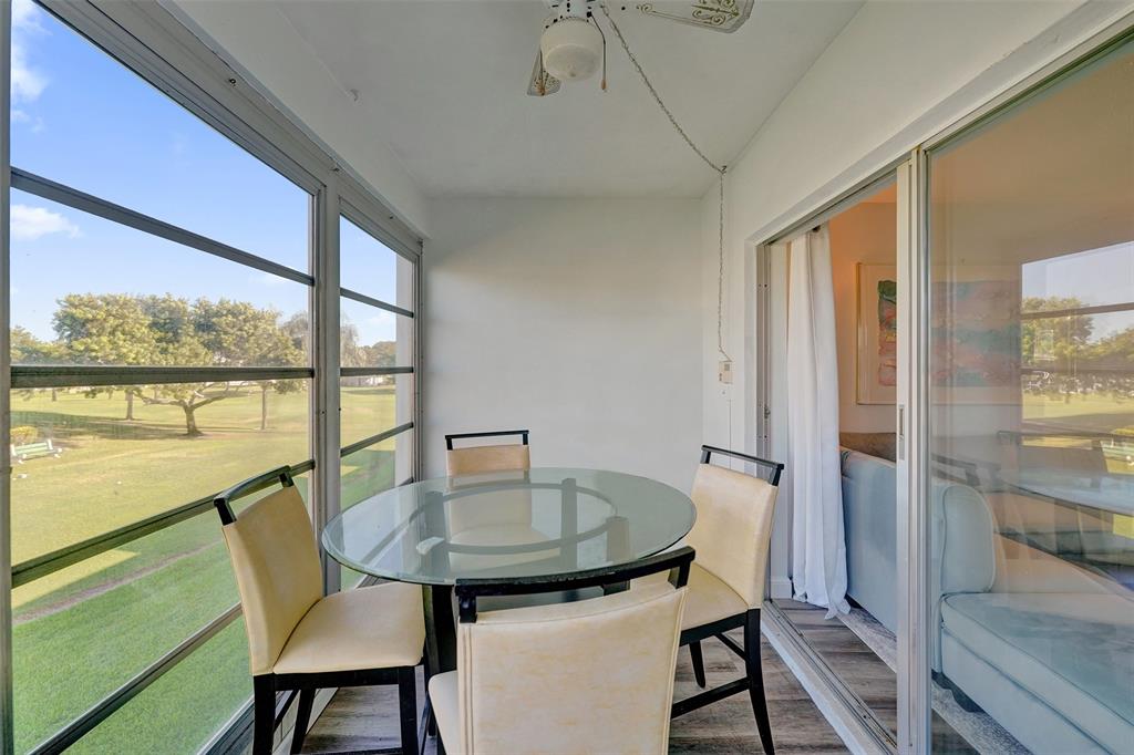 2751 East Golf Boulevard, Unit 2019 Pompano Beach, FL 33064 - Photo 41 of 68 a view of a dining room with furniture window and outside view