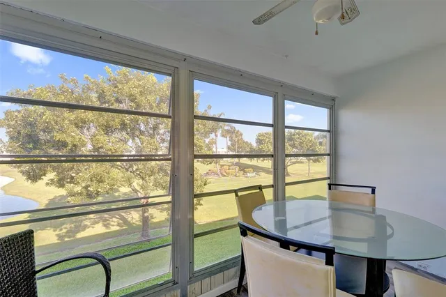an aerial view of residential houses with outdoor space and river