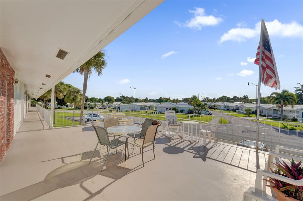 2751 East Golf Boulevard, Unit 2019 Pompano Beach, FL 33064 - Photo 44 of 68 a view of swimming pool with outdoor seating and city view