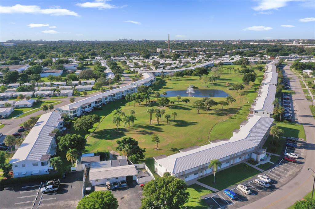 2751 East Golf Boulevard, Unit 2019 Pompano Beach, FL 33064 - Photo 53 of 68 an aerial view of residential houses with outdoor space and river