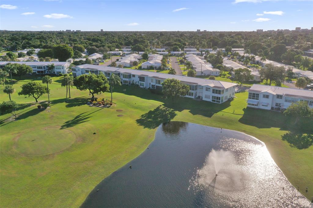 2751 East Golf Boulevard, Unit 2019 Pompano Beach, FL 33064 - Photo 61 of 68 a view of a lake in a city