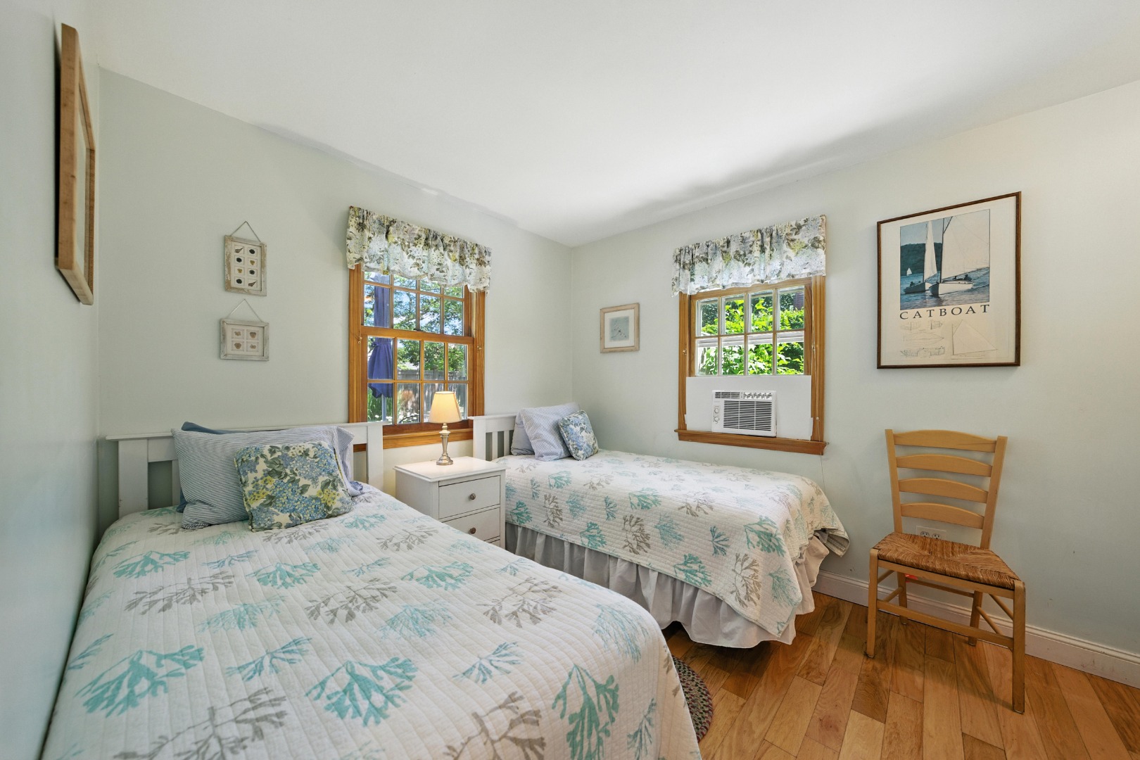 52 Pleasant Street Nantucket, MA 02554 - Photo 18 of 36 a bedroom with two beds and a window