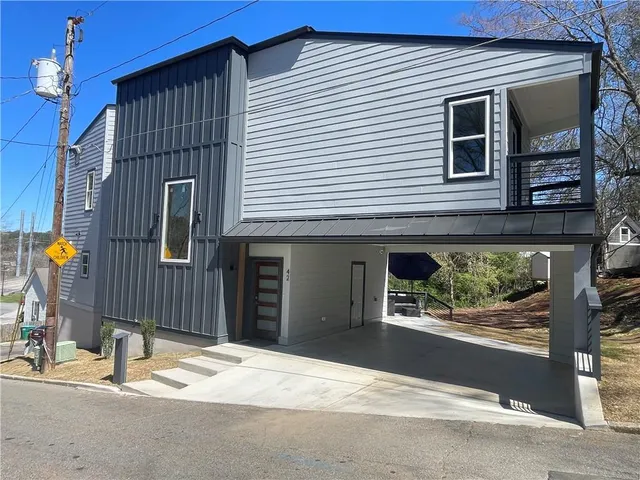 a front view of a house with a garage