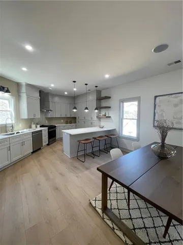 a kitchen with a table and chairs in it