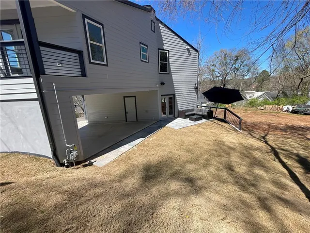 a building outdoor space with patio furniture and potted plant