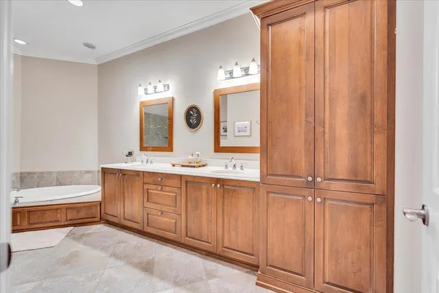 a bathroom with a sink a mirror and a bathtub