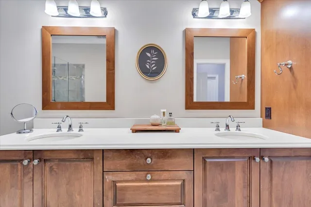 a bathroom with a sink vanity and a mirror