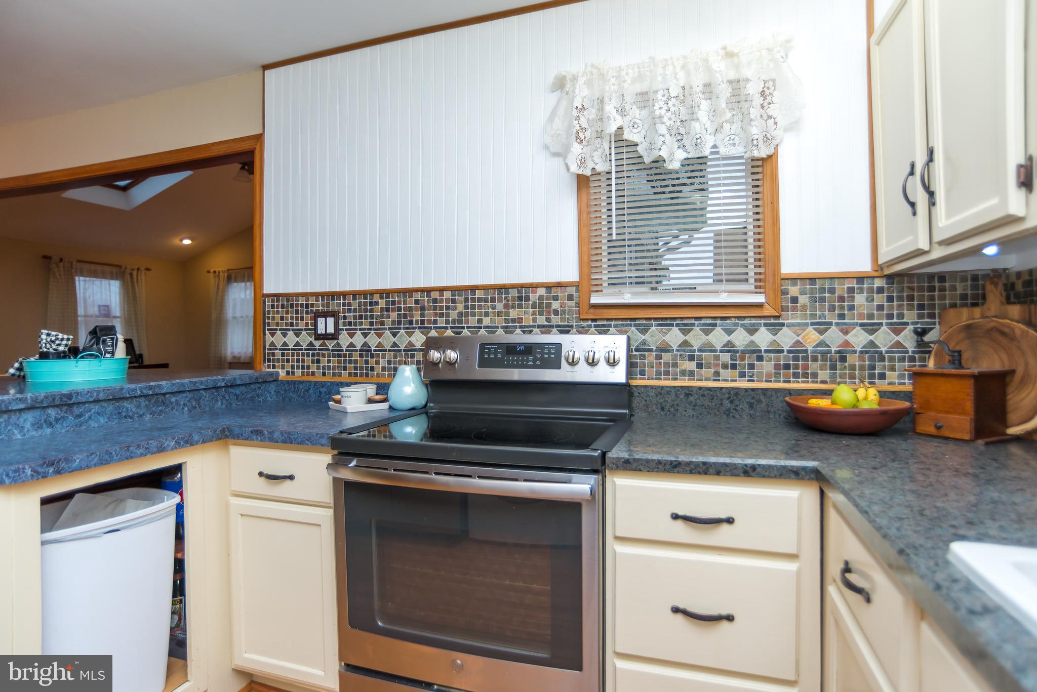 57 Handy Road Levittown, PA 19056 - Photo 9 of 23 Stainless stove and flat surface oven.