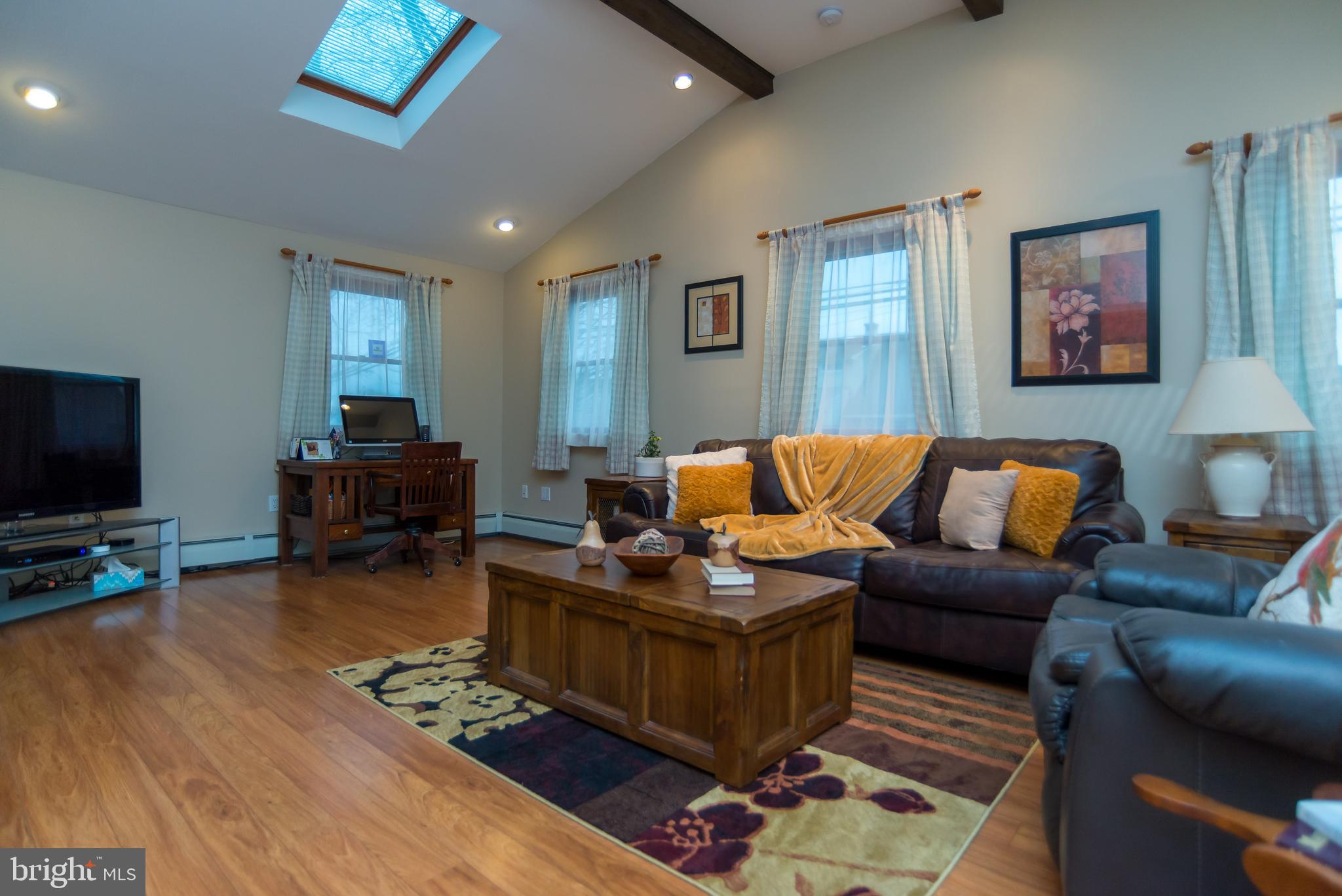 57 Handy Road Levittown, PA 19056 - Photo 10 of 23 Family Room with Volume Ceiling and Hardwoods