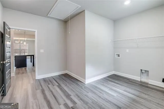 a view of a room with wooden floor